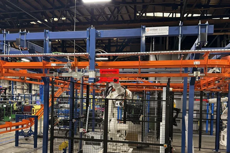 Detailed view of MCM Autotrack overhead conveyor tracks and suspended carrier components